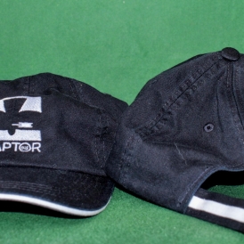 Black hat with white RAPTOR Logo front and back of hat